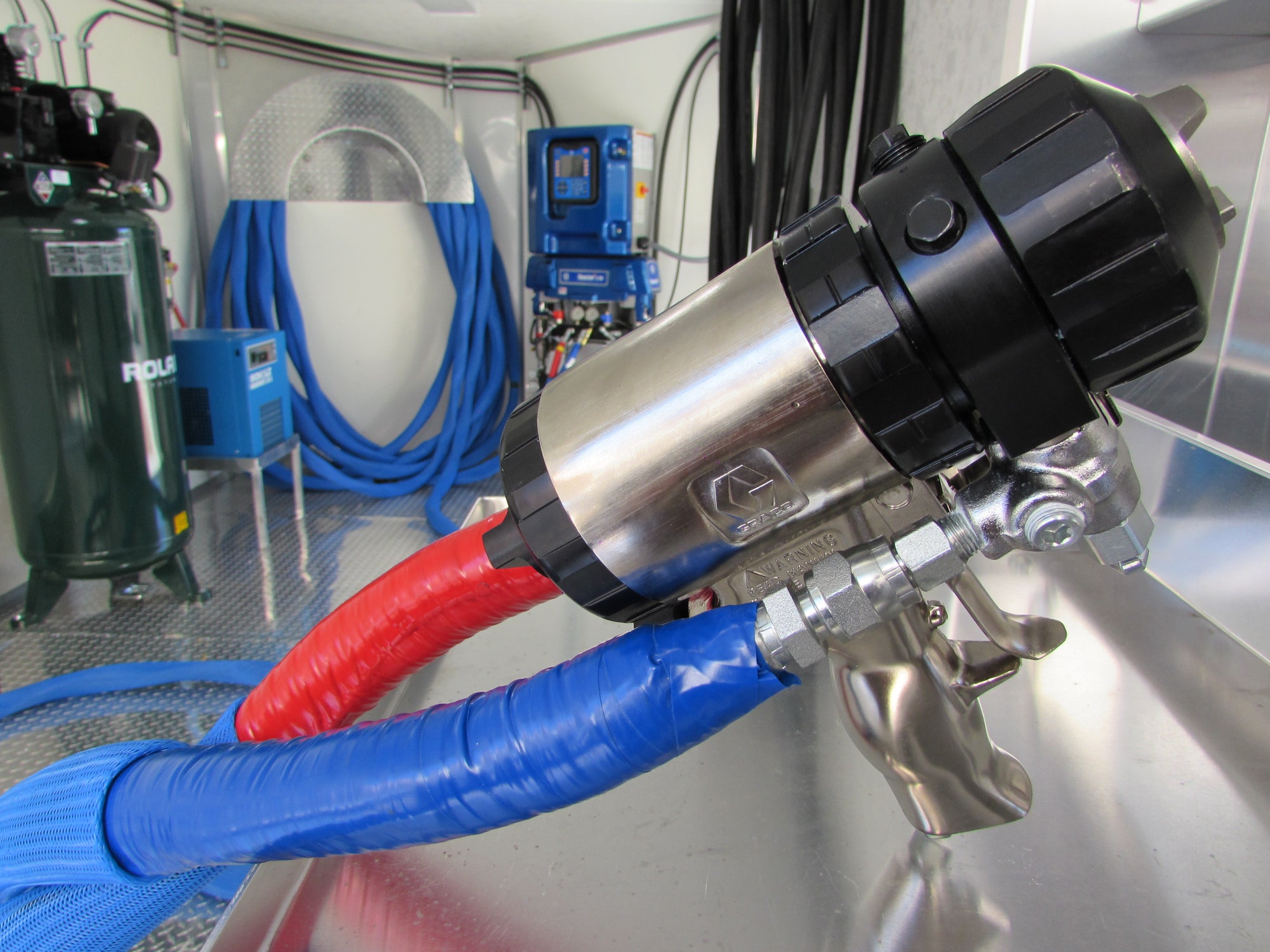 Graco E30 Reactor 2 spray foam rig with Graco AP Fusion gun, 100 feet of shore power cable, and 7'x16' trailer