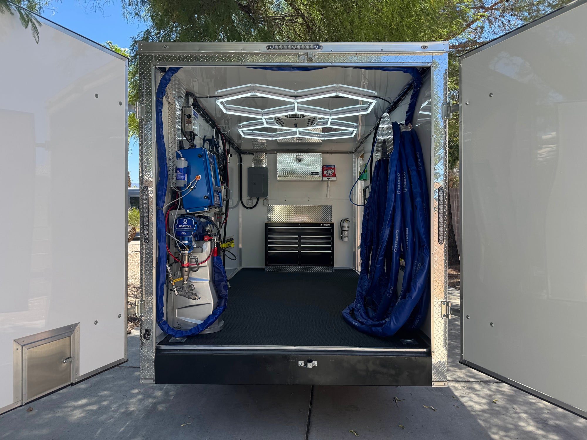 Graco E30 Reactor 3 spray foam rig with Graco PC or FX Fusion gun, 40kW diesel generator, and 7'x20' trailer with double door